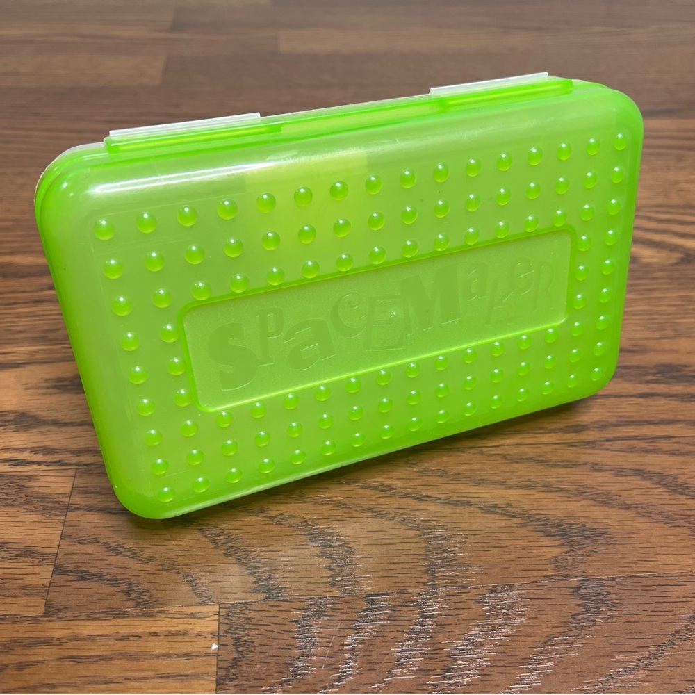 vintage 1990s Spacemaker pencil box in a neon green color